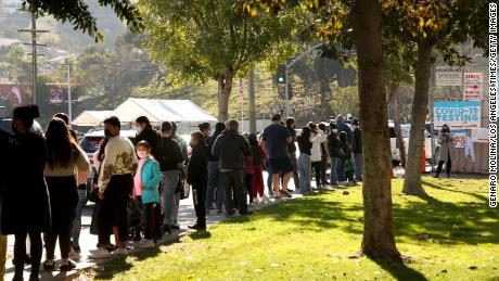 Students and staff wait in line for a Covid-19 test at a school in Los Angeles.