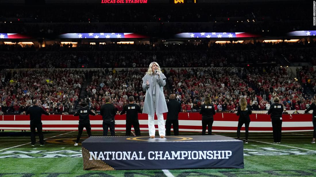 Natalie Grant sings the National Anthem  during the pregame festivities.