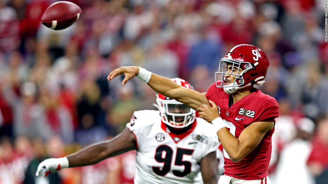 Young throws a pass during the first half.