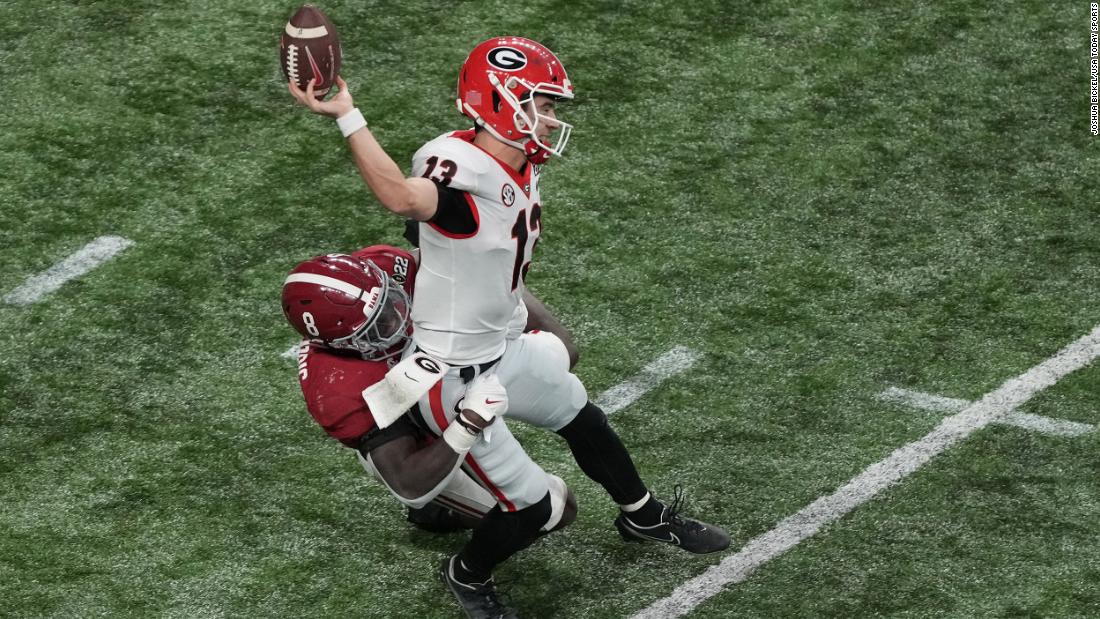 Bennett fumbles the ball as he is hit by Alabama linebacker Christian Harris in the fourth quarter. Alabama recovered deep in Georgia territory and went on to score a touchdown.