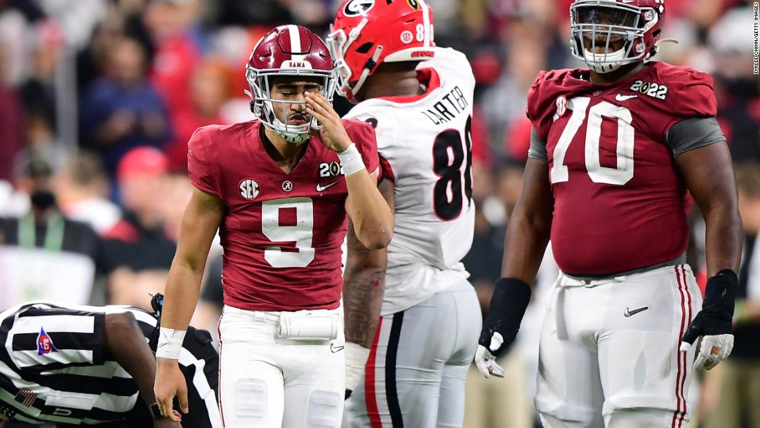 Young adjusts his helmet after being sacked in the fourth quarter. Young, this season&#39;s Heisman Trophy winner, was under heavy pressure for much of the game Monday.