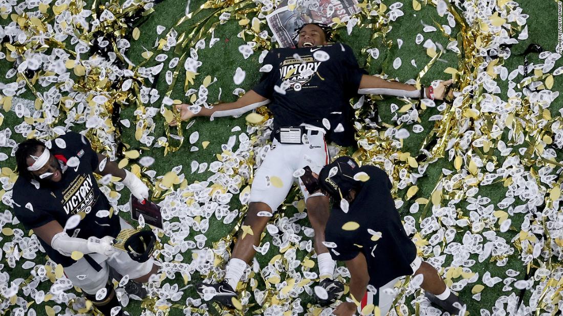 Georgia players celebrate in the confetti.