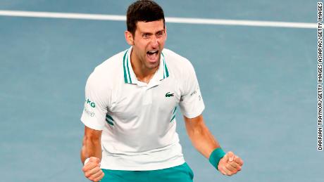 Djokovic celebrates victory at last year's Australian Open. 