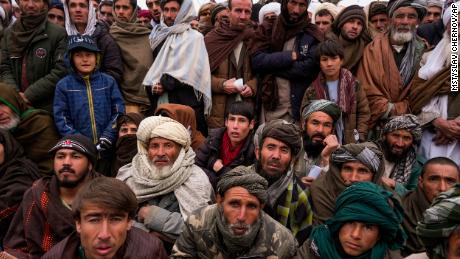 Hundreds of Afghan men gather to apply for the humanitarian aid in Qala-e-Naw, Afghanistan, Tuesday, Dec. 14, 2021. In a statement Tuesday, Jan. 11, 2022, the White House announced $308 million in additional humanitarian assistance for Afghanistan, offering new aid to the country as it edges toward a humanitarian crisis since the Taliban takeover nearly five months earlier. 