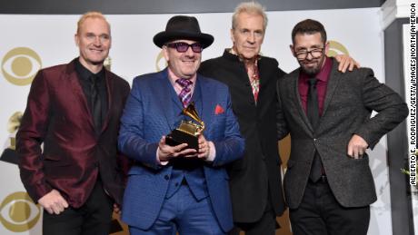 Elvis Costello &amp; The Imposters (from left: Davey Faragher, Elvis Costello, Pete Thomas and Sebastian Krys) are shown at the 62nd Annual Grammy Awards at LA's Staples Center on January 26, 2020. 
