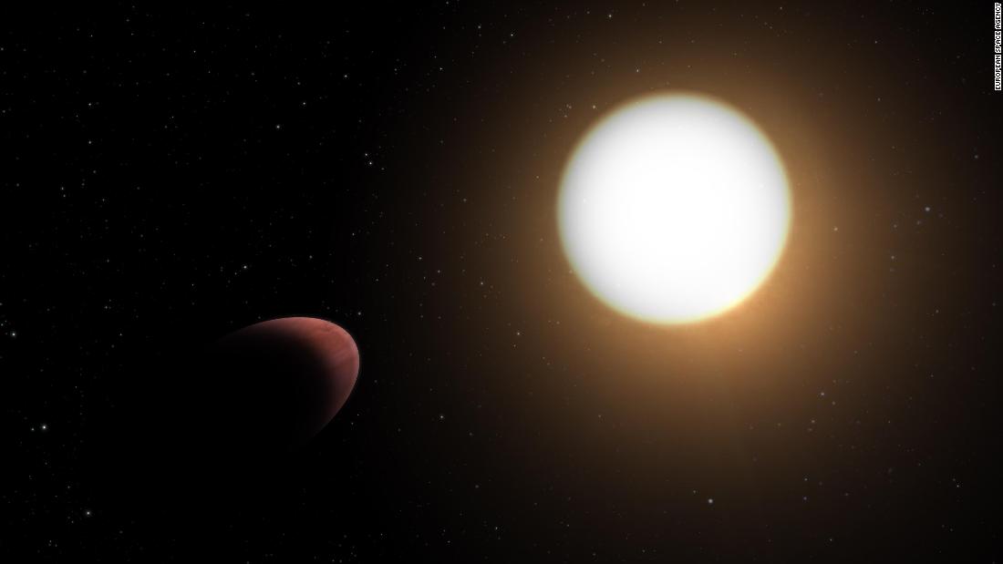This artist&#39;s impression shows the football-shaped planet WASP-103b (left) closely orbiting its host star.