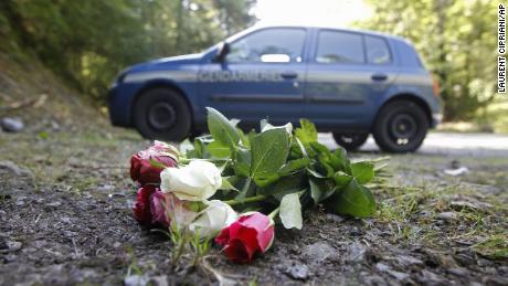 Flowers are shown laid at the scene where four people were shot dead near Chevaline, in the French Alps, in a September 2012 file photo.