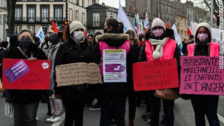 Demonstrators gather in the city of Clermont-Ferrand on Thursday as French teacher and student unions call for a national strike in protest over the government&#39;s Covid-19 protocols for schools.