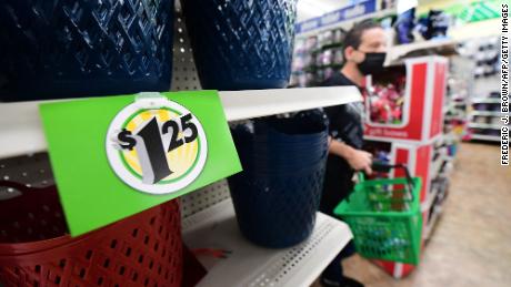 A sign displaying a price of $1.25 is displayed on the shelves of a Dollar Tree store in Alhambra, California, December 10, 2021.