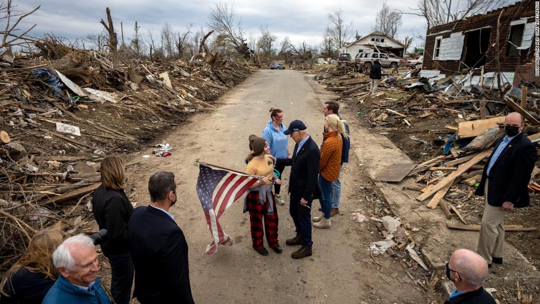 Biden speaks with a person holding an American flag as he tours tornado damage in Dawson Springs, Kentucky, on December 15.&lt;br /&gt;&lt;br /&gt;Dozens of people were killed after a &lt;a href=&quot;https://www.cnn.com/2021/12/11/weather/gallery/midwest-tornadoes-damage/index.html&quot; target=&quot;_blank&quot;&gt;tornado outbreak&lt;/a&gt; flattened homes and businesses across eight states in the Midwest and South. Many of the victims were in western Kentucky.&lt;br /&gt;&lt;br /&gt;&quot;As (Biden) walked down this street, a young girl stood with an American flag not far from where her house once stood,&quot; New York Times photographer Doug Mills said. &quot;President Biden asked how she and her family were doing. She explained that her house was destroyed but her family was OK. I could not believe the devastation. It went on as far as you could see.&quot; &lt;br /&gt;&lt;br /&gt;The President announced that day that the federal government &lt;a href=&quot;https://www.cnn.com/2021/12/15/politics/biden-kentucky-visit/index.html&quot; target=&quot;_blank&quot;&gt;would cover 100% of the costs of emergency work for the first 30 days.&lt;/a&gt; That coverage includes shelter, debris removal and the cost of overtime for law enforcement and emergency personnel.