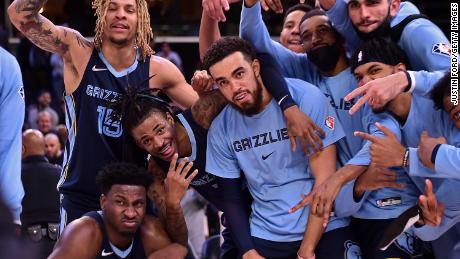 The Memphis Grizzlies pose for a photo after the game against the Minnesota Timberwolves.