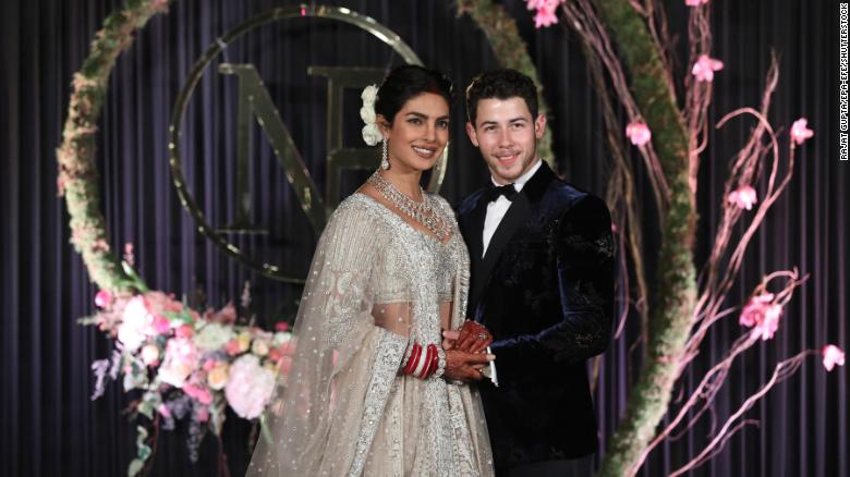 Newlyweds Priyanka Chopra and Nick Jonas pose for photographs during a reception in New Delhi on  December 4, 2018. 