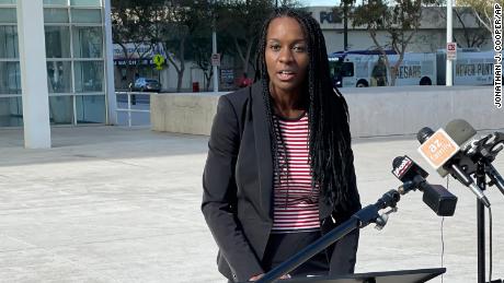 Talonya Adams speaks to reporters outside the federal courthouse in Phoenix on December 9, 2021. 