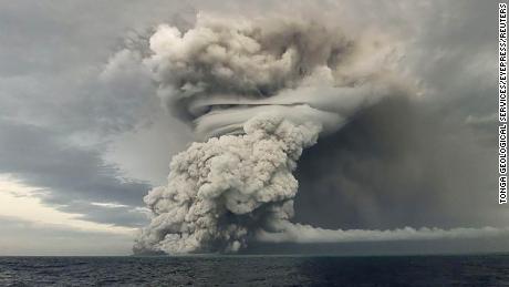 Ash rises into the air after a powerful underwater volcanic eruption in the South Pacific. 