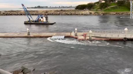 High tide comes into a harbor in Santa Cruz, California, seen in this still image from a video obtained by CNN. The water quickly drained out, Brad Anderson -- the person that provided the video -- said.