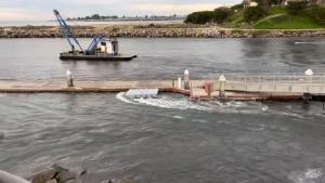 CNN obtained video of high tide coming into a harbor and beach in Santa Cruz, CA. The water drained out quickly, Brad Anderson - the person that provided the video - said.