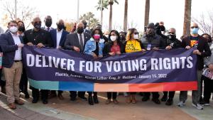 Rep. Ruen Gallego, left, The King family, middle, and other local activists lead the march across the 16th Street overpass to call for voting rights in honor of Martin Luther King Jr. on Saturday, Jan. 15, 2021 in Phoenix. (Rick Scuteri/AP Images for Deliver for Voting Rights)