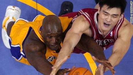 Yao goes after a rebound with Los Angeles Lakers&#39; Shaquille O&#39;Neal in 2004.