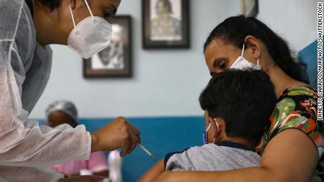 A child receives a Covid-19 vaccine in the Brazilian city of Volta Redonda on Monday.