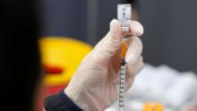 A medic prepares a dose of the Pfizer-BioNTech vaccine against the coronavirus at a private nursing home in the Israeli central coastal city of Netanya on January 5, 2022. - Israel began on January 3 administering fourth Covid vaccine shots to people over 60 and health workers amid a surge driven by the Omicron variant. (Photo by JACK GUEZ / AFP) (Photo by JACK GUEZ/AFP via Getty Images)