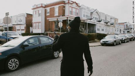 Larry Miller walks towards his childhood home at 57th and Catharine in West Philadelphia on Wednesday, January 12, 2022.