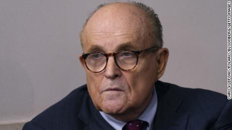 Rudy Giuliani, personal lawyer to U.S. President Donald Trump, listens as President Donald Trump speaks during a news conference in the James S. Brady Press Briefing Room at the White House in Washington, D.C., U.S., on Sunday, Sept. 27, 2020. Trump denied a report that he paid just $750 in federal income taxes in 2016 and 2017, and repeated his stance to only share his tax returns after an audit is finished. Photographer: Chris Kleponis/Polaris/Bloomberg via Getty Images