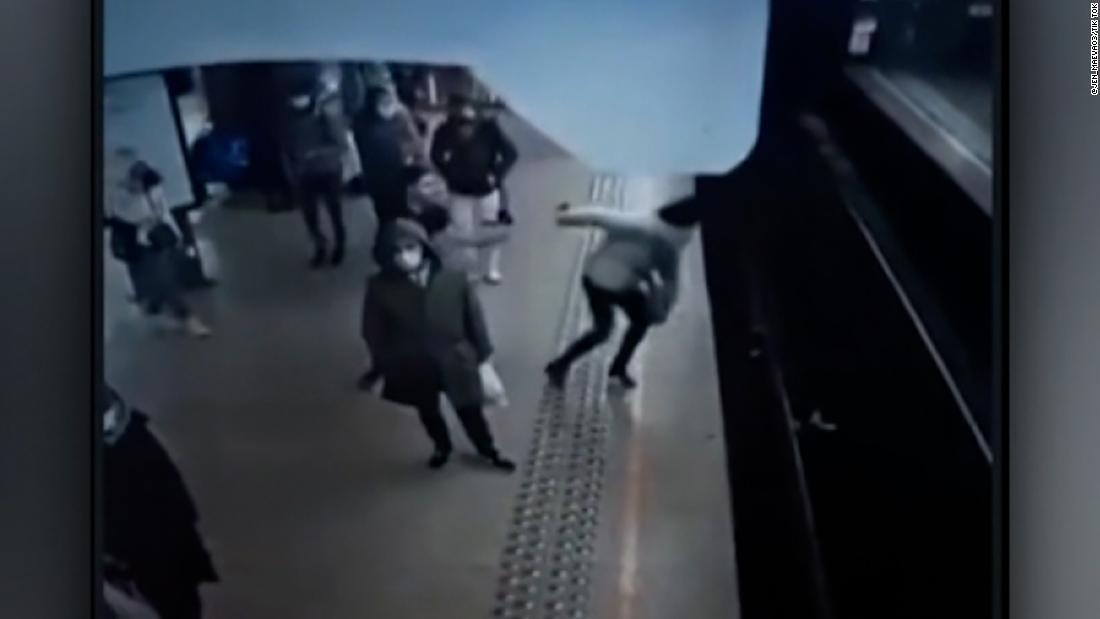 Woman narrowly survives push from platform in front of approaching train