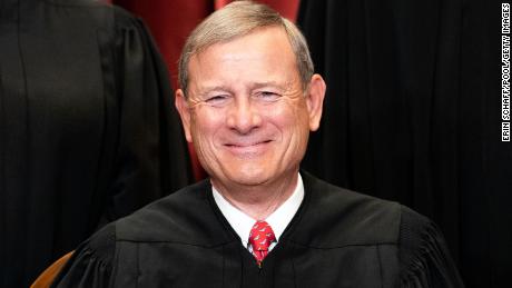 Chief Justice John Roberts sits during a group photo of the Justices at the Supreme Court on April 23, 2021. 