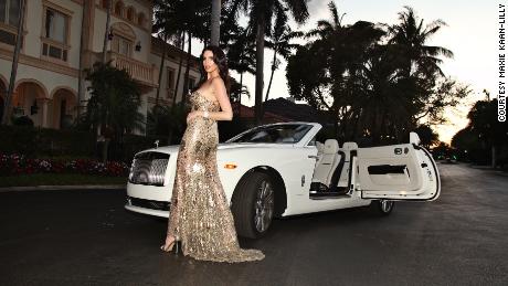 Maxi Kan-Lily, 30, with a Boca Raton, Florida, real estate agent and model, Rolls-Royce Dawn.