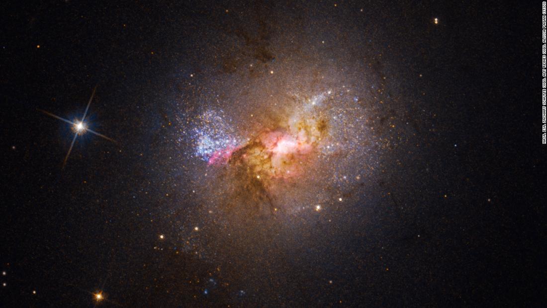 Hubble spots a black hole nurturing stars, rather than devouring them