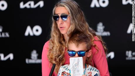 Victoria Azarenka sits with her son Leo during a press conference following her third round win over Elina Svitolina.
