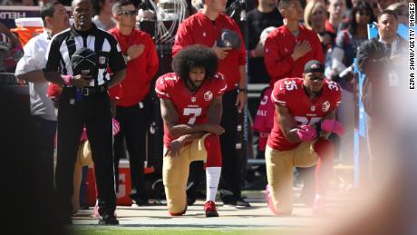 Kneeling during the national anthem as a protest against social injustice became a large political issue in the US from the time Colin Kaepernick (seen here with then teammate Eric Reid of the 49ers) began the trend in 2016.
