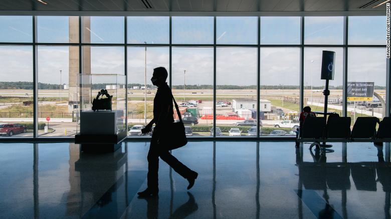 A traveler walks through the George Bush Intercontinental Airport on December 03, 2021 in Houston, Texas. 