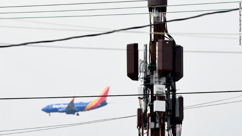 A 5G cellular tower stands as a Southwest Airlines Co. Boeing 737 airplane lands at Los Angeles International Airport (LAX) in the Lennox neighborhood of Los Angeles, California, on January 19.