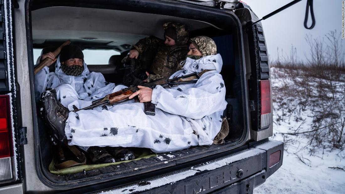 Soldiers sit in the back of a truck in Slov&#39;yanoserbs&#39;k, Ukraine.