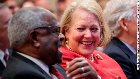 WASHINGTON, DC - OCTOBER 21: (L-R) Associate Supreme Court Justice Clarence Thomas sits with his wife and conservative activist Virginia Thomas while he waits to speak at the Heritage Foundation on October 21, 2021 in Washington, DC. Clarence Thomas has now served on the Supreme Court for 30 years. He was nominated by former President George H. W.  Bush in 1991 and is the second African-American to serve on the high court, following Justice Thurgood Marshall. (Photo by Drew Angerer/Getty Images)