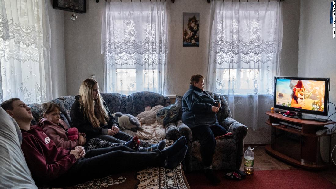 Viktoria, right, watches television with her 10-year-old daughter and her son and his girlfriend in Marinka. When asked if she had a message for the world leaders involved in the conflict Viktoria said: &quot;Stop. Just stop. It&#39;s enough. Think about your children if they were here.&quot;