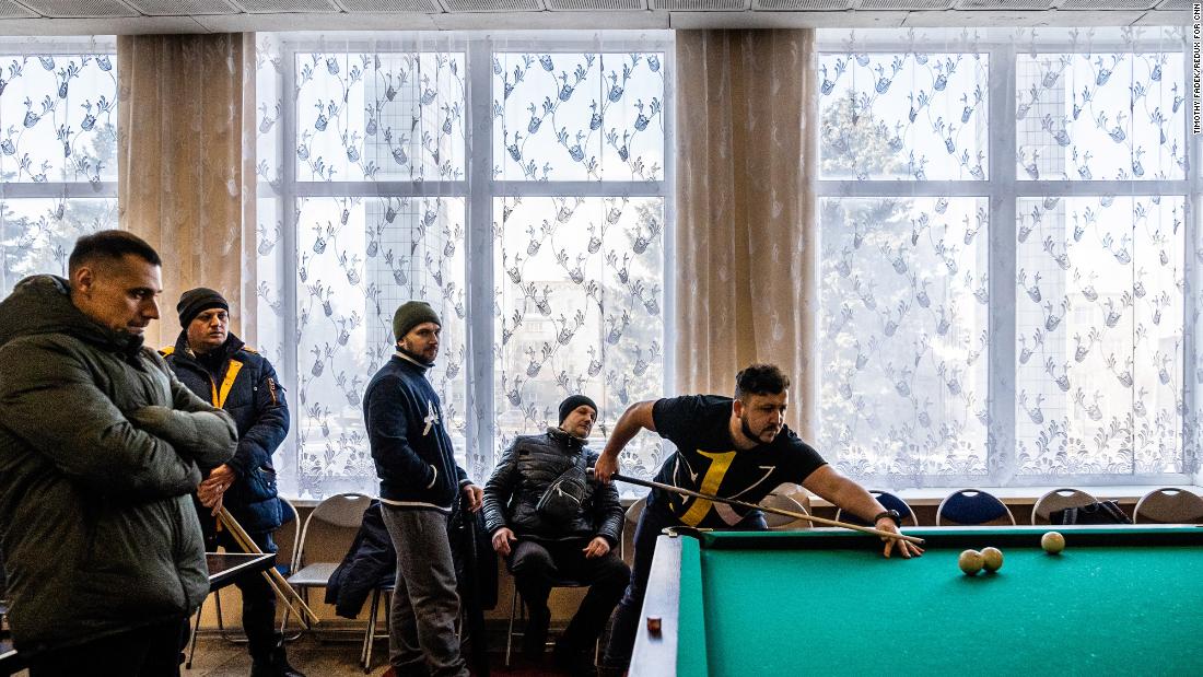 Men play billiards in Marinka during a local tournament.