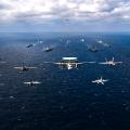 Aircraft fly over a US-Japan naval flotilla that included two US aircraft carriers in the Philippine Sea on Saturday.