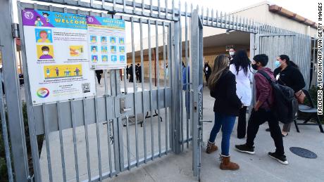 Students return to campus at Olive Vista Middle School on the first day back following the winter break amid a dramatic surge in Covid-19 cases across Los Angeles County on January 11, 2022 in Sylmar, California.