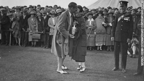 Hagen, winner of the British Open golf championship at Hoylake, kisses his wife.