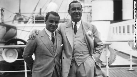 Hagen (right) stands with Gene Sarazen (left) aboard the RMS Aquitania upon arrival at Southampton, 21 June 1933.