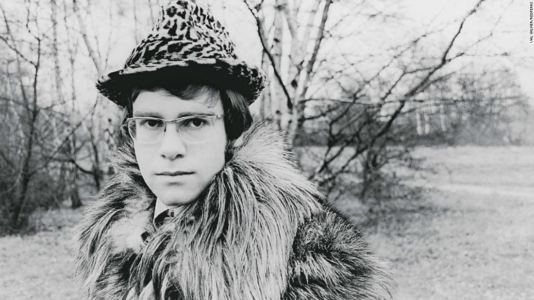 John appears in one of his first publicity photos in 1968. The singer had officially changed his name to Elton John a year earlier after being born as Reginald Kenneth Dwight in Pinner, England, in 1947. The name was inspired by members of his early band, Bluesology, whose saxophone player was Elton Dean and lead singer was Long John Baldry.