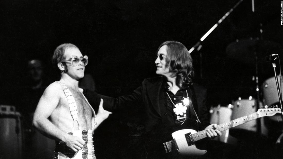 John appears on stage with John Lennon at New York&#39;s Madison Square Garden in 1974.