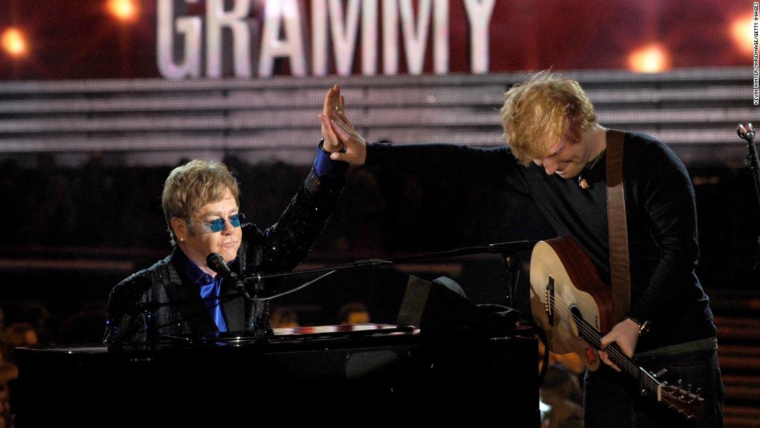 John performs with Ed Sheeran at the 2013 Grammy Awards. They teamed up for Sheeran&#39;s song &quot;The A Team.&quot;