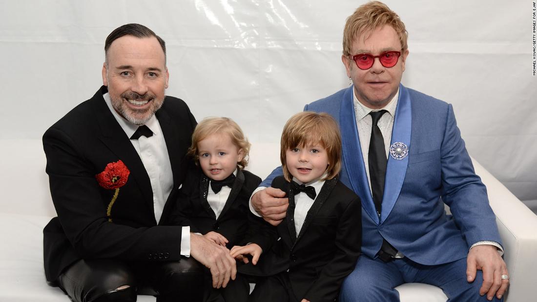 John, Furnish and their two boys pose for a photo in 2015.