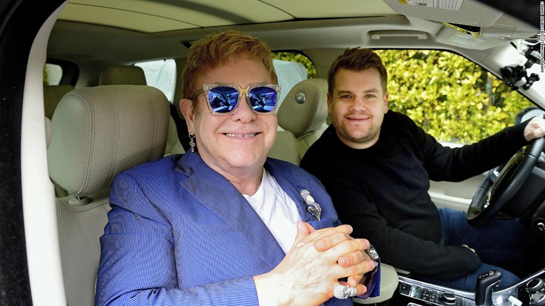 John joins talk-show host James Corden for a a little &quot;carpool karaoke&quot; in 2016.