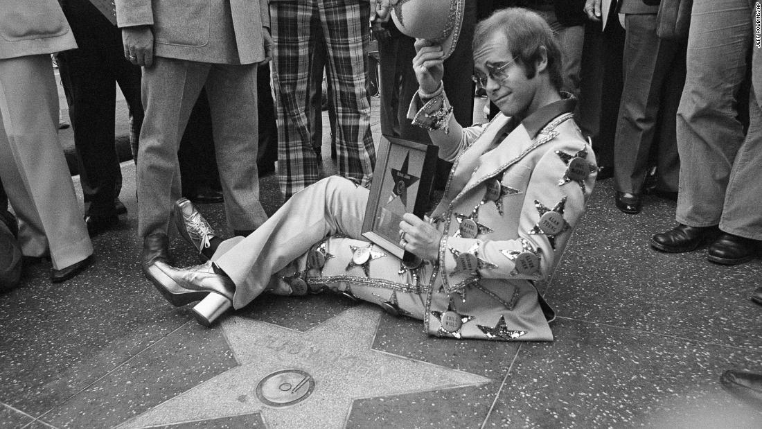 John tips his hat after having a star dedicated to him on the Hollywood Walk of Fame in 1975.