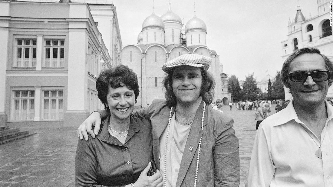 John poses with his mother and stepfather while touring the Kremlin in Moscow in 1979. He was the first rock or pop star from the West to perform in the Soviet Union.