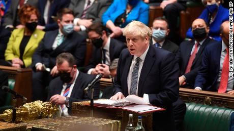 Boris Johnson speaks during Prime Minister's Questions in the House of Commons on January 12, 2022. Johnson apologized for attending a garden party during Britain's first coronavirus lockdown, but brushed aside opposition demands that he resign for breaching his government's rules.